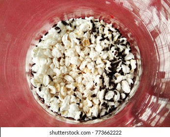 Beetles, Lucky Animal In Thailand, Small Black Insects Eating Popped Rice, Sorghum In Glass Plate On Red Background
