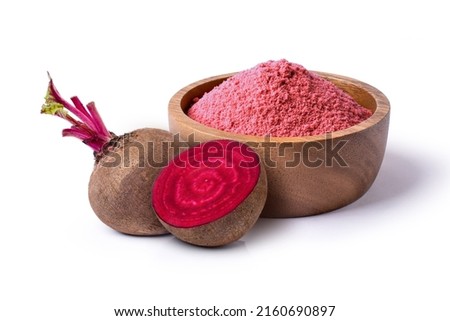 Beetroot (beet root) powder in wooden bowl with fresh fruit isolated on white background.