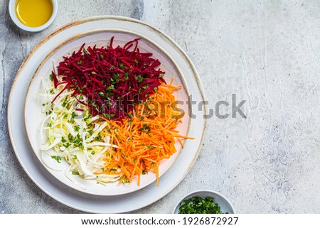 Beetroot, carrot, cabbage salad in a bowl. Detox food concept.