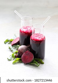 Beetroot Drink Cocktail In A Glass Bottle With A Straw On A Light Gray Background