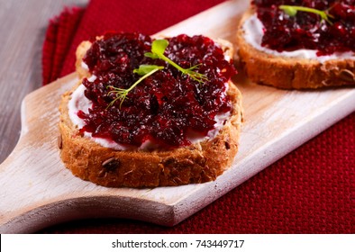 Beetroot Relish Over Brown Bread On Board