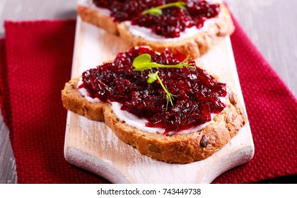 Beetroot Relish Over Brown Bread On Board