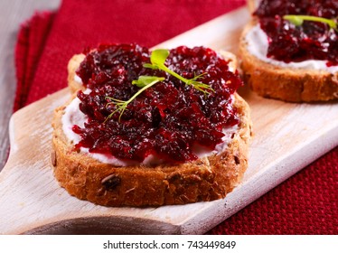 Beetroot Relish Over Brown Bread On Board