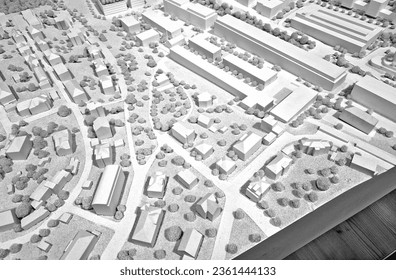 before the construction of houses and neighborhoods, the proposal must be defended in the urban concept. spatial development plan glued from model paper. architect presents his ideas and points hands - Powered by Shutterstock