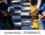 Before every big racing event, fans sign the start finish line, leaving names and messages of support for their favorite drivers, wishing them luck and success. It’s a cherished pre-race tradition.