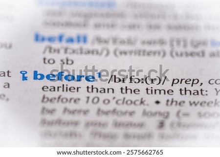 Before word in a dictionary. Selective focus, close up.
