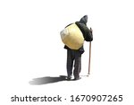 A beggar man with a bag over his shoulders and a stick goes on a white background with shadow.