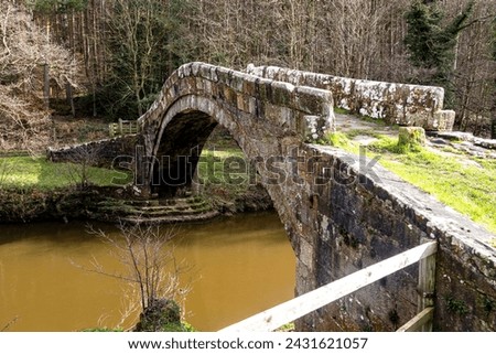 Beggar's Bridge is a 17th-century single-arched packhorse bridge across the River Esk, on the eastern edge of Glaisdale village and the northern fringe of the North York Moors National Park UK.