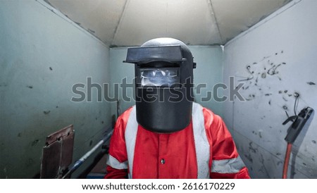 Beginner Welder Learning Welding Techniques with Complete PPE Safety Gear