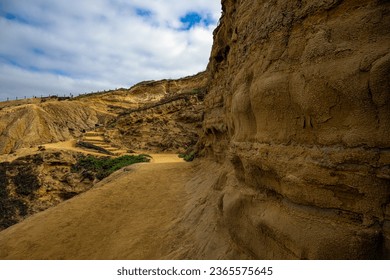 THE BEGINNING OF THE HO CHI MINH TRAIL AT TORREY PINES LEADING TO BLACK BEACH WITH A CLOUDY SKY NEAR SAN DIEGO CALIFORNIA