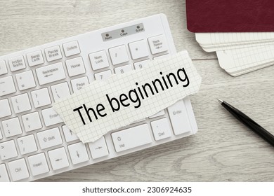 The beginning. text on torn paper on white keyboard - Shutterstock ID 2306924635