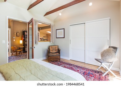 Behind The Bed Of A Bright Open Bedroom With Open Beams In A Secluded Wine Country Home