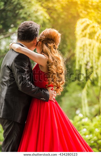 Behind Couple Stood Hugging Each Other Stock Photo (Edit Now) 434280523