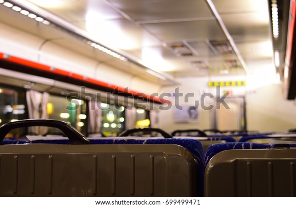 Behind the passenger train\
seats.