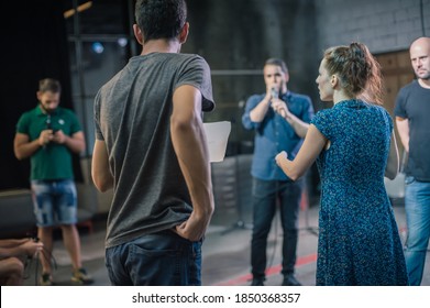 Behind the scene. Director of the play rehearses the play with the actors according to the script - Powered by Shutterstock