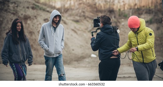 Behind The Scene. Film Crew Team Filming Movie Scene On Outdoor Location. Group Cinema Set