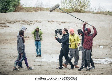 Behind The Scene. Film Crew Team Filming Movie Scene On Outdoor Location. Group Cinema Set