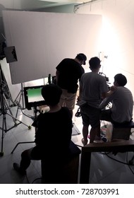 Behind The Scene Of Silhouette Film Crew Team Shooting Video Commercial Production And Camera Equipment In Home Studio.