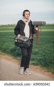 Behind The Scene. Sound Operator Technician With Boom Microphone On The Set Outdoor