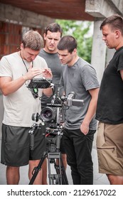 Behind The Scenes. Film Crew Team Shooting Movie Scene On Outdoor Location. Group Filmmaking Set Production