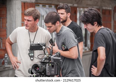 Behind The Scenes. Film Crew Team Shooting Movie Scene On Outdoor Location. Group Filmmaking Set Production