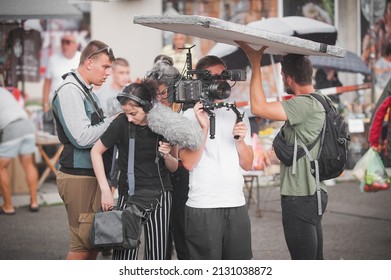 Behind The Scenes. Film Crew Team Shooting Movie Scene On Outdoor Location. Group Filmmaking Set Production