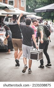 Behind The Scenes. Film Crew Team Shooting Movie Scene On Outdoor Location. Group Filmmaking Set Production