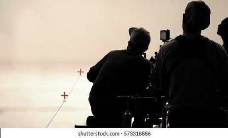 Behind The Scenes Or Making Of Film In The Studio And Silhouette Of Camera Man.