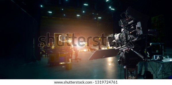 Behind the scenes of making of
movie and TV commercial. Camera of movie and video production. Film
Crew. B-roll, and crew team in studio and set on dark
background