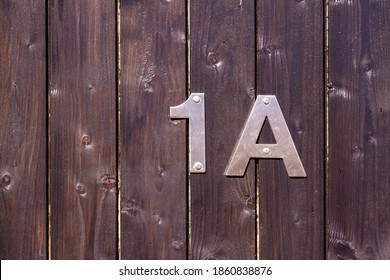 Behind A Wooden Gate Lies House Number 1A