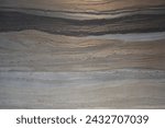 Beige and black wavy marble wall