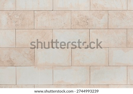 Beige brick wall as a background, texture, pattern.
