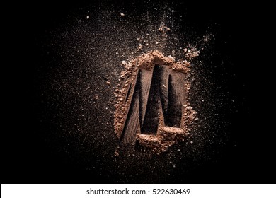 Beige Broken And Scattered Eye Shadow Isolated On Black Background