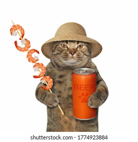 The Beige Cat In A Straw Hat Is Eating A Grilled Skewer Shrimp And Drinking Beer From A Can. White Background. Isolated.