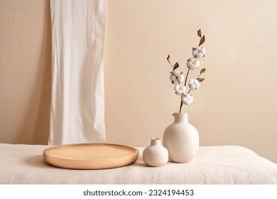 Beige ceramic vases with dry cotton branches. Stylish and minimalistic background for display your products in living room. Scandinavian interior. Modern home decor. Copy space. - Shutterstock ID 2324194453