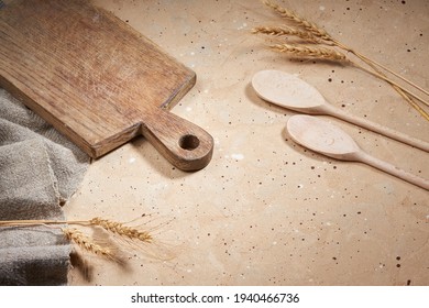 Beige Cooking Background With Old Cutting Board, Wooden Kitchenware, Ears Of Rye And Linen Fabric,  Top View, Copy Space. Cooking Course Poster