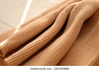 Beige Cotton Jersey Fabric Background Above, With Sunlight