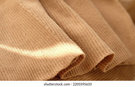 Beige Cotton Jersey Fabric Background Above, With Sunlight