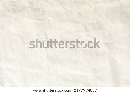 Beige crumpled paper background texture