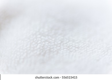 Beige delicate soft  background of plush fabric. Beige background of plush fabric. Shallow depth of field.