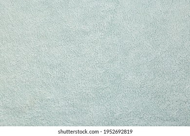 Beige Green Towel. Terry Towel Texture. Soft Cotton Fabric Towel Texture. Detail Of Textured Bath Towel.