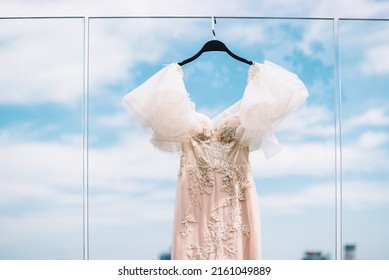 Beige Handmade Casual Wedding Dress Hang On The Glass Veranda City View
Bride's Morning 