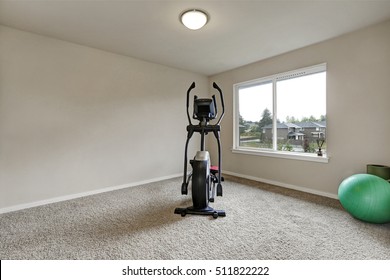 Beige Interior Of Small Home Gym With Sport Equipment . Northwest, USA