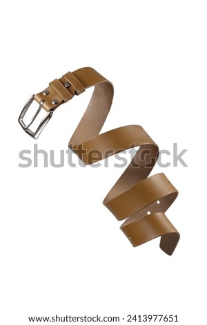 Beige leather belt twisted and isolated on a white background.