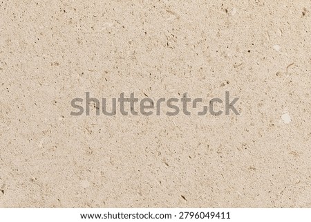 Beige limestone texture with small dots