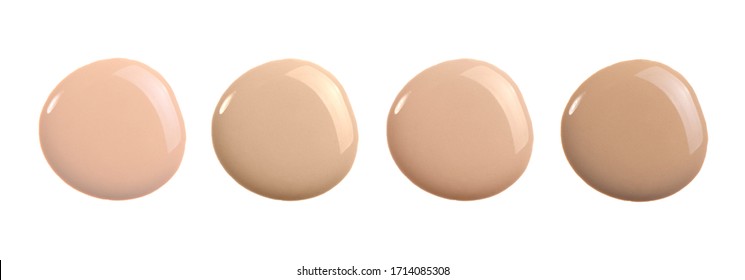 Beige liquid foundation shades, concealer smear smudge drop. Makeup cosmetic swatch isolated on white. Nude cosmetic BB cream sample for correcting skin tone. Cosmetic liquid concealer or moisturizer