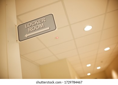 Beige Locker Room Sign On A Tiled Wall Inside A Factory,