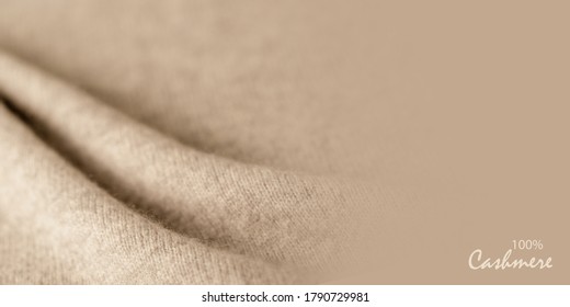 Beige luxury natural cashmere. Blurred background with copy space