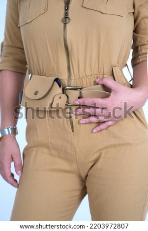 beige overall with woman model