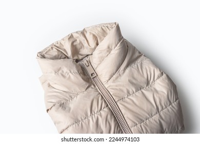Beige padded coat zipper ,down jacket, rain proof winter jacket on white background.Top view